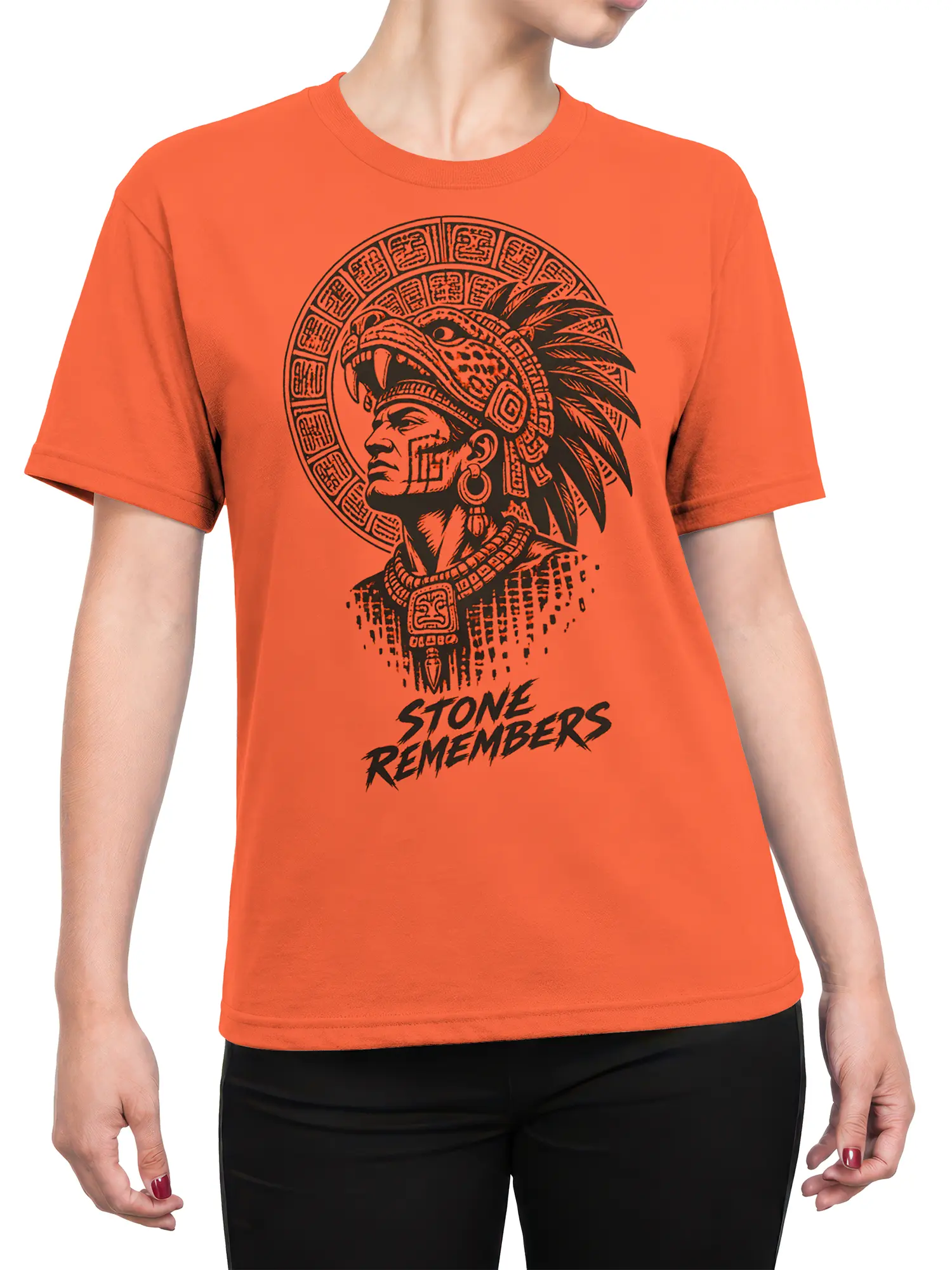 Female torso wearing an orange T-shirt with a black warrior portrait and Stone Remembers design