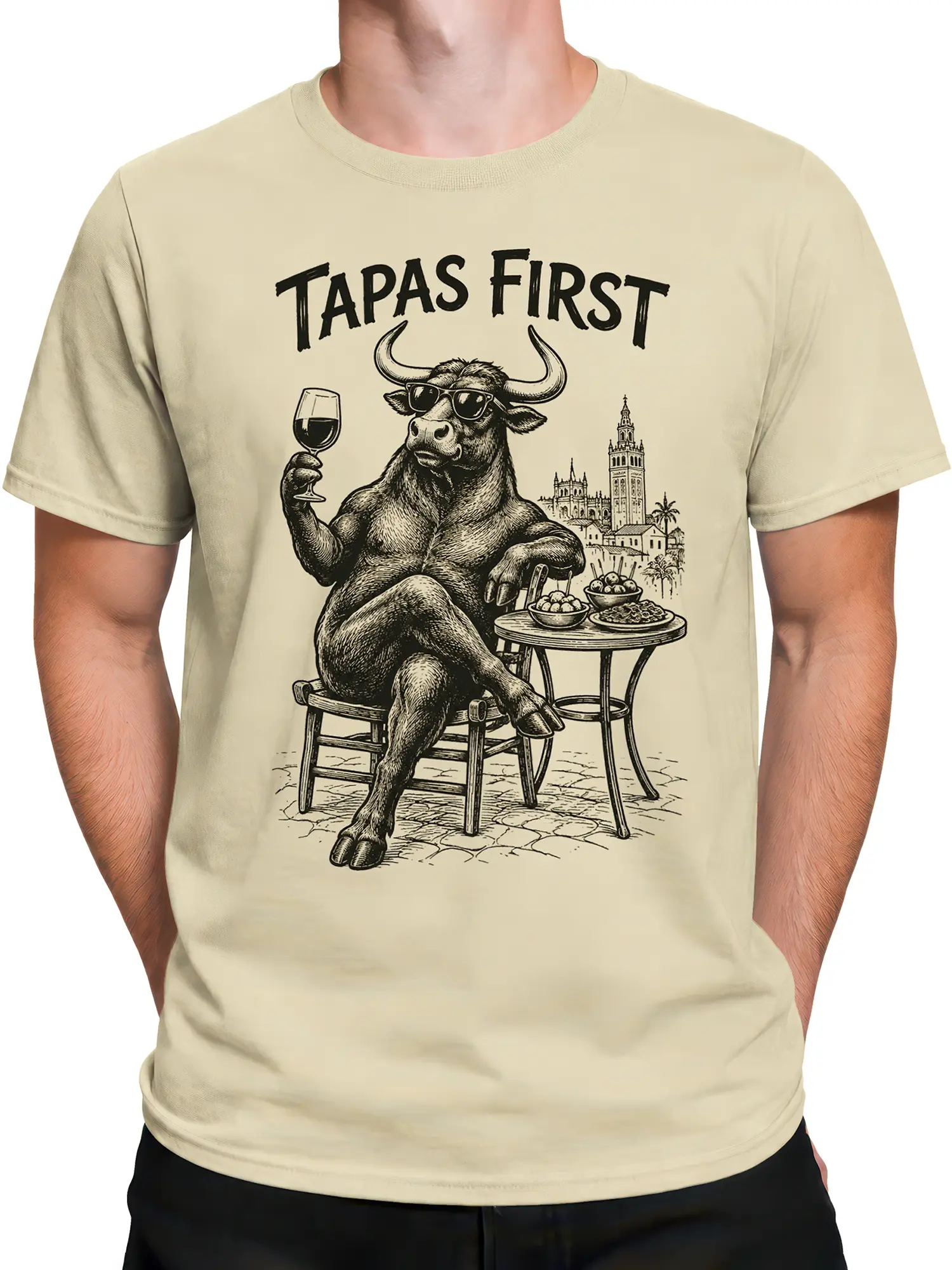Male torso wearing a beige Tapas Bull T-shirt with wine, tapas, sunglasses, and vintage city artwork