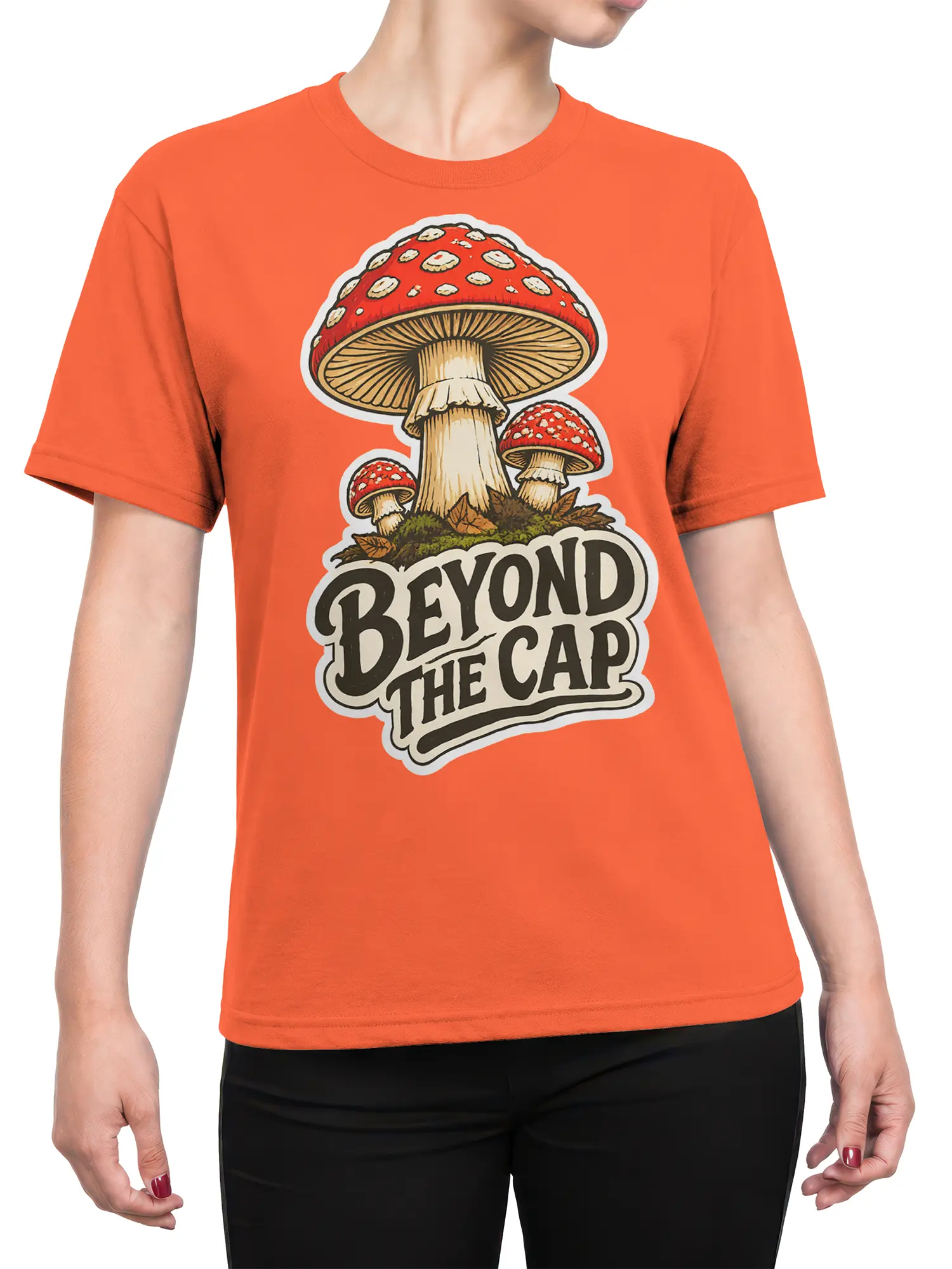 Female torso wearing an orange mushroom T-shirt with vintage fungi artwork and “BEYOND THE CAP” lettering