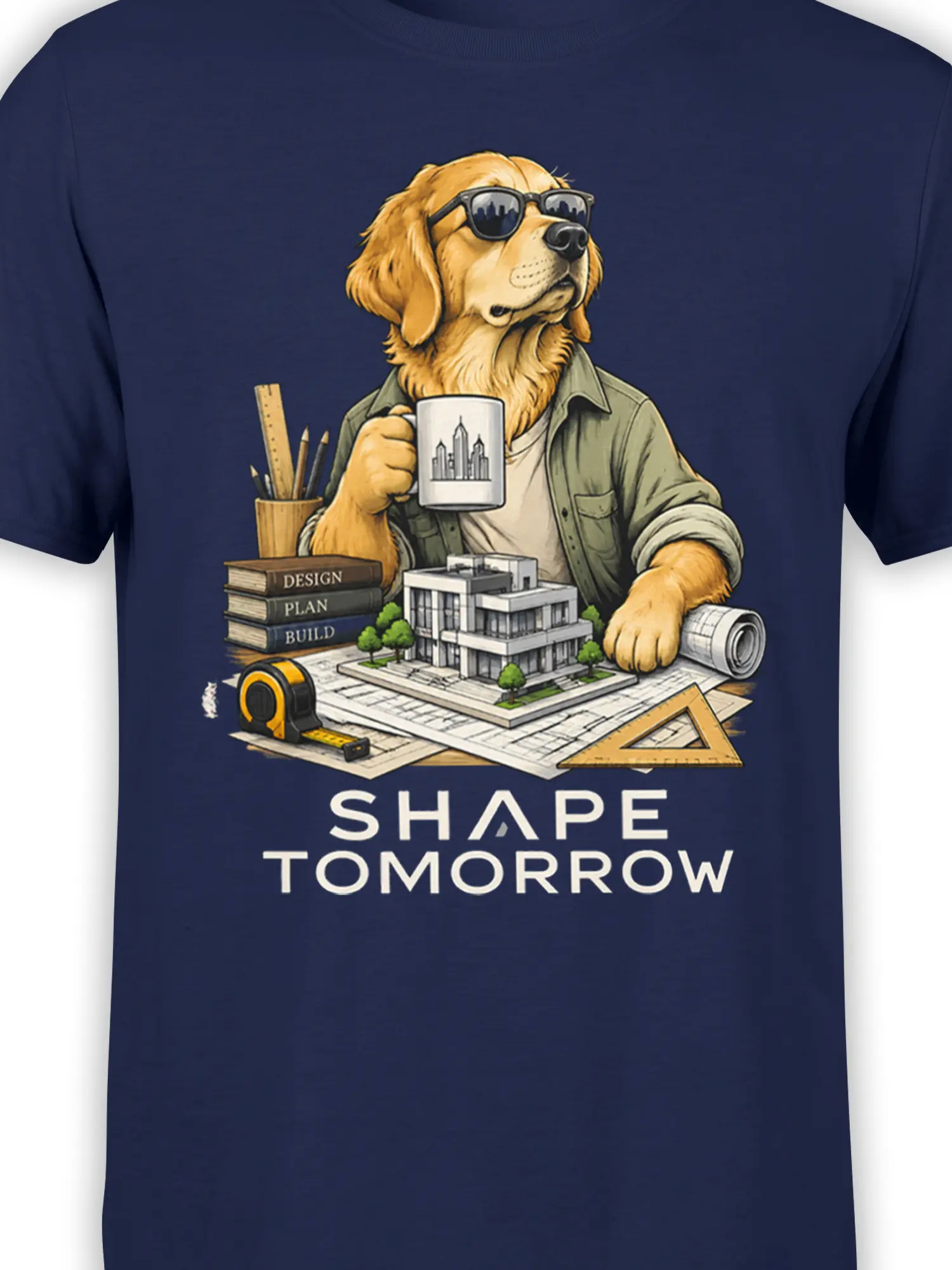 Close-up of golden retriever architect artwork with blueprints, tools, and “Shape Tomorrow” text on navy fabric