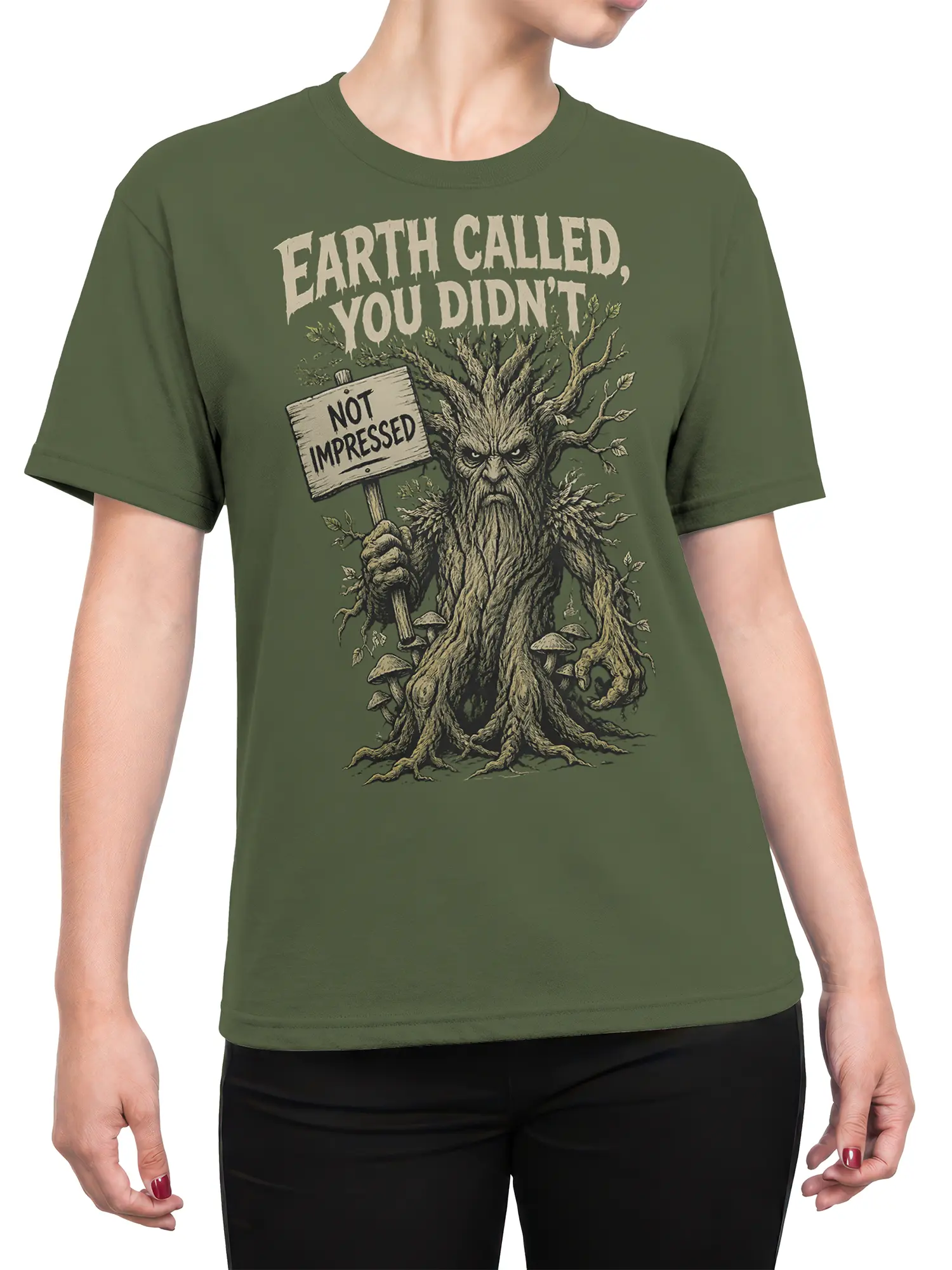 Female torso wearing a green T-shirt with a grumpy tree creature fantasy design