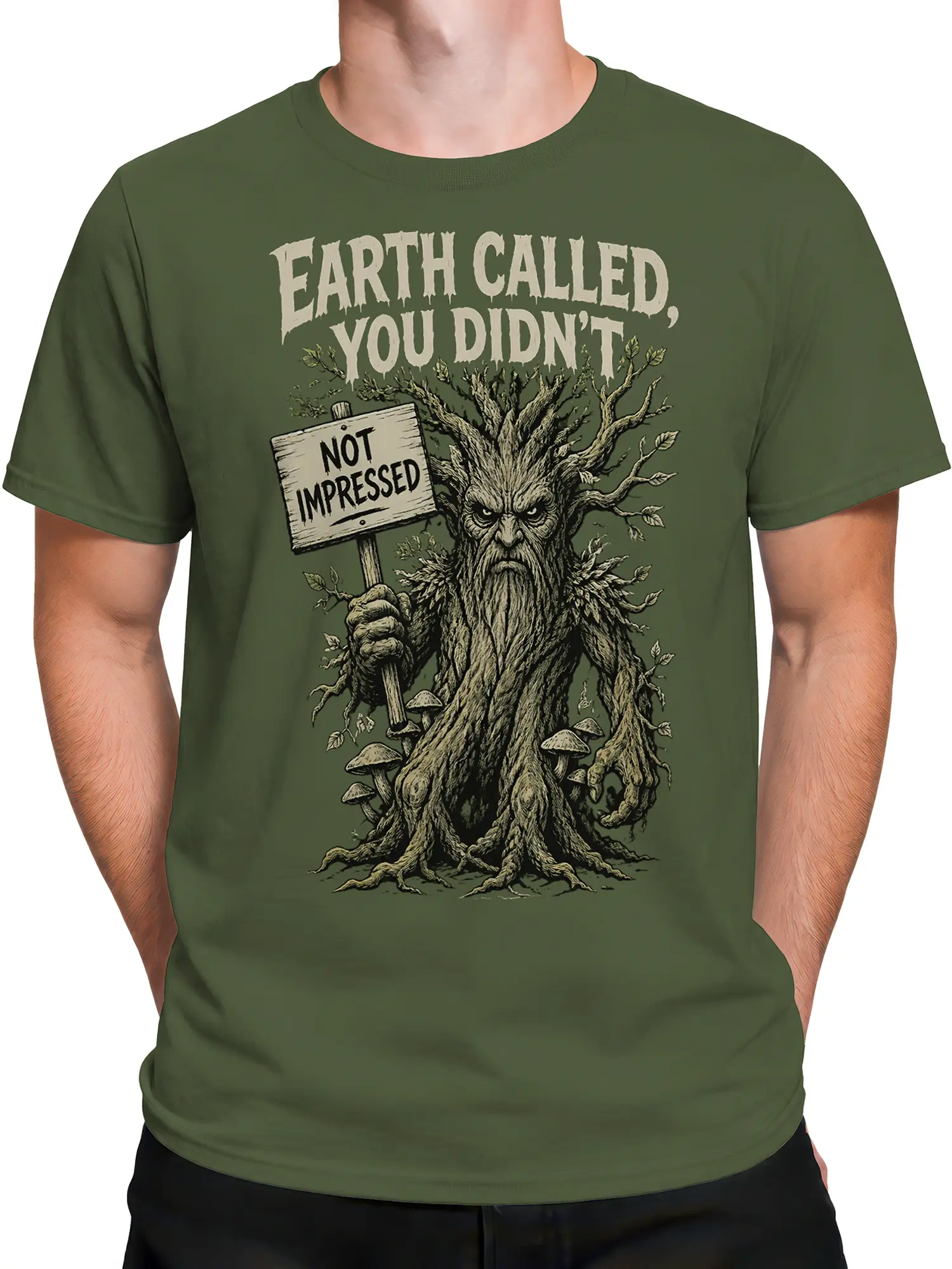 Male torso wearing a green T-shirt with a grumpy tree creature fantasy design
